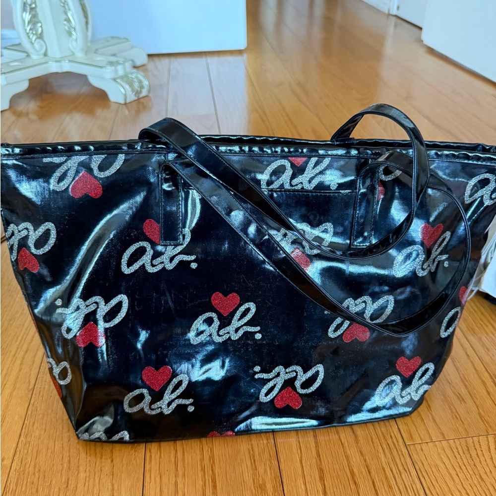 Agnès b. VOYAGE Black Patent Coated Canvas Tote with Heart Logo Print